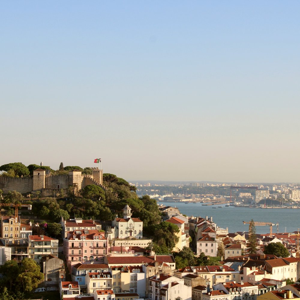 Castelo de São Jorge — the medieval hilltop castle in Lisbon, with the Tagus estuary and Alfama district visible from the ramparts